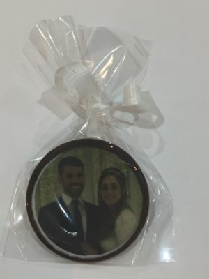 photo of couple on chocolate disk